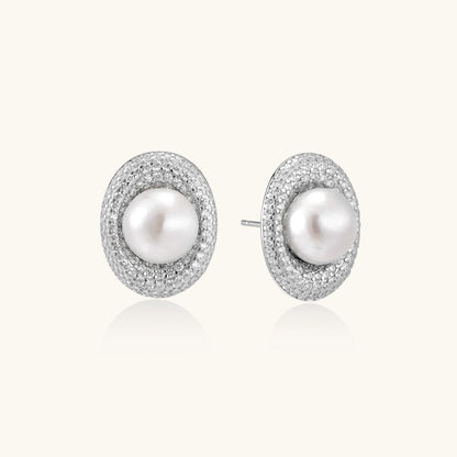 Elegant stud earrings with cream freshwater pearls surrounded by sparkly pavé crystals on rhodium-plated silver setting